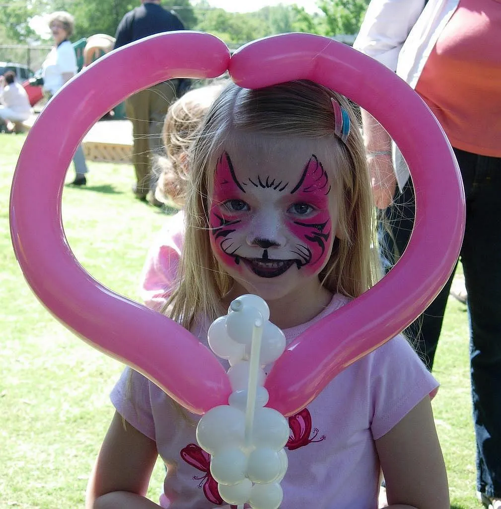 Pink Kitty Face Painting with Balloon Dog