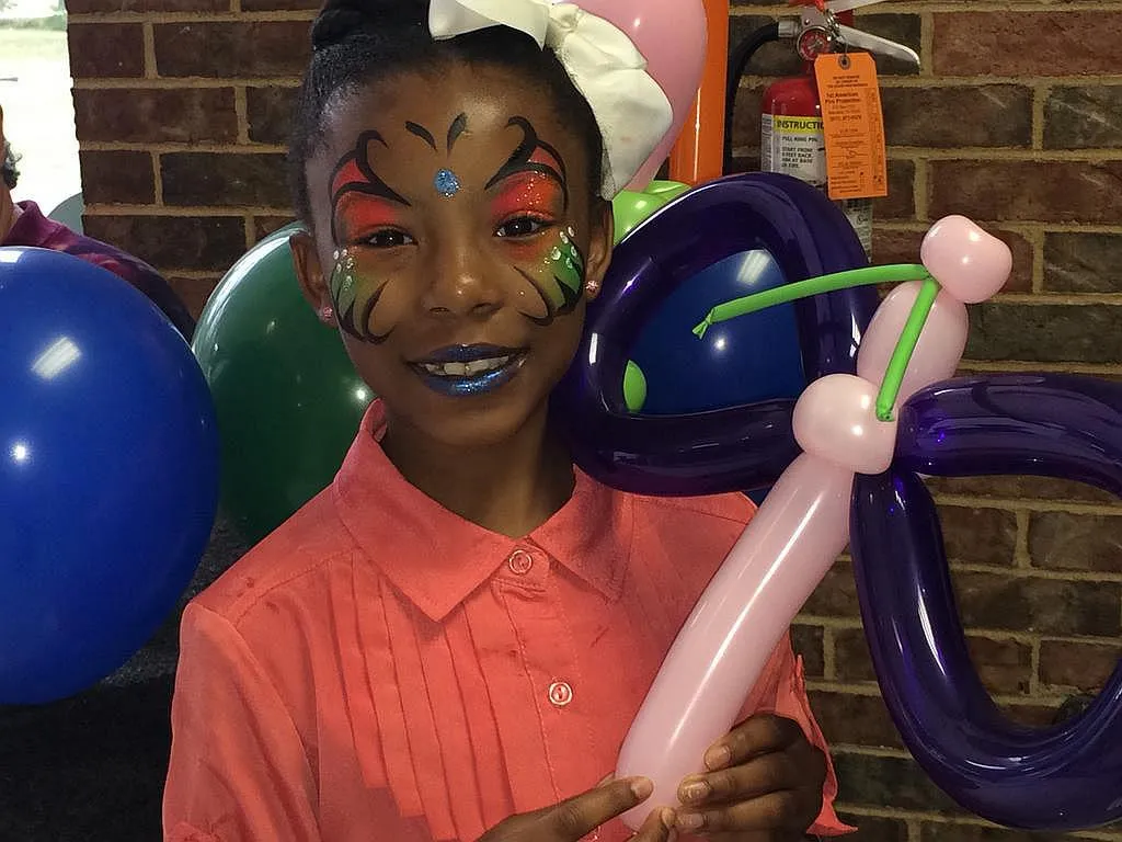 Butterfly Face Painting with Butterfly Balloon